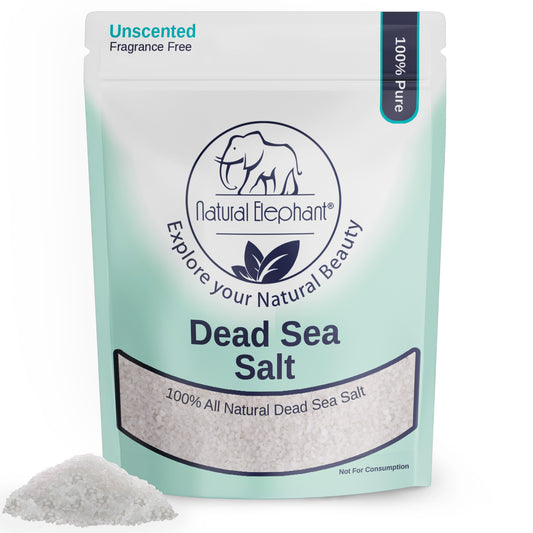 A standing pouch labeled Natural Elephant Coarse Dead Sea Salt, featuring a blue elephant logo. The white and light blue-green bag is unscented, 100% pure, all-natural, with a small pile of salt highlighting its therapeutic benefits.