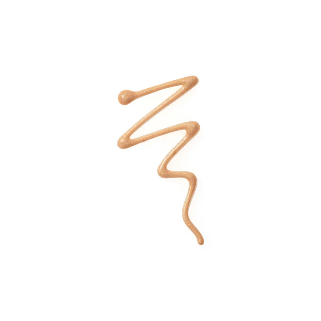 A squiggly line of Bodyography Radiant Glow Primer + Niacinamide, a shimmery bronze hydrating primer, adds a radiant glow against a white background.