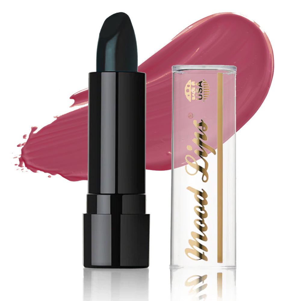 A black Mood Lips Color Changing Lipstick tube with a clear cap, labeled in gold, is displayed before a pink smear. This stylish lipstick provides vibrant, long-lasting color and is enriched with Antioxidant Vitamins.