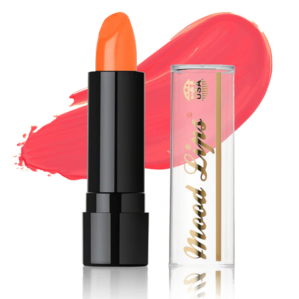 A tube of Mood Lips Color Changing Lipstick with a black base and clear cap sits in front of a pink swatch, highlighting this long-lasting lipstick enriched with antioxidant vitamins.