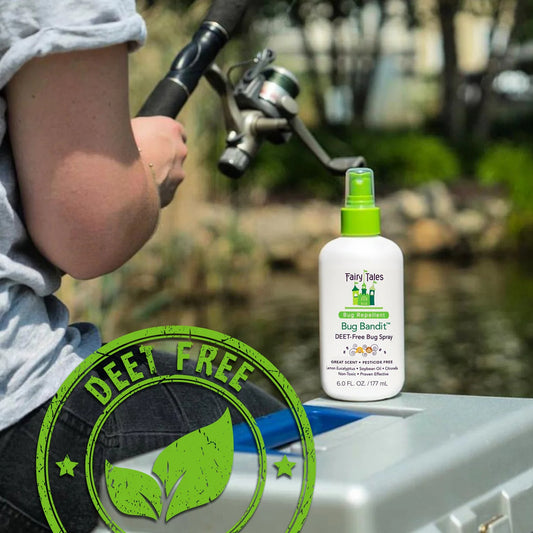 Fairy Tales Bug Bandit bottle on boat near person fishing featuring DEET free bug spray for kids label