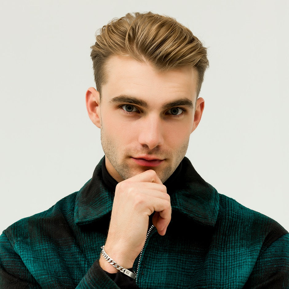 Model showcasing hairstyle styled with Johnny B Hold Tight Clay Gel for a sleek look