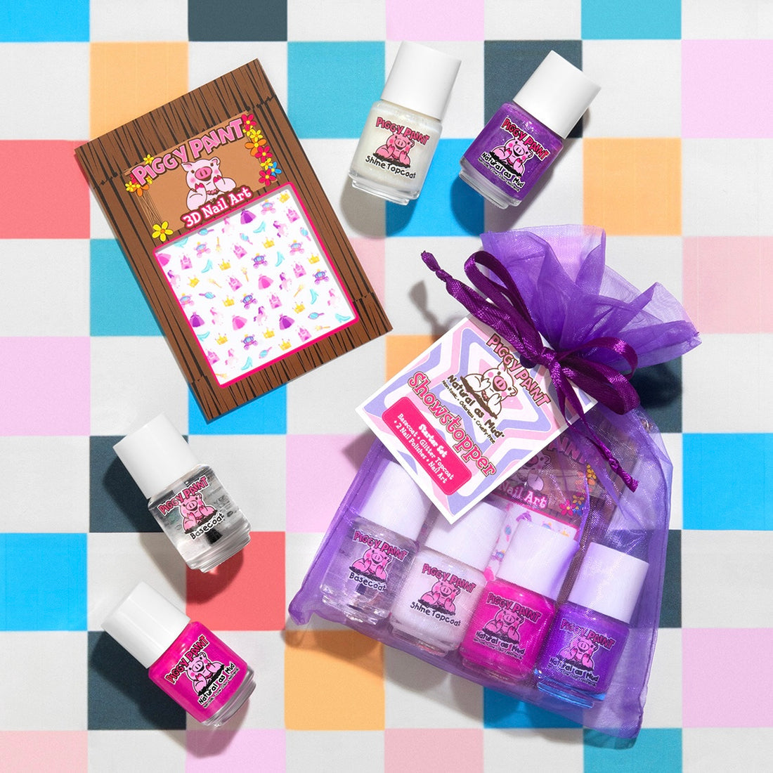 Piggy Paint starter set with four nail polish bottles and a 3D nail art kit, all in a colorful gift bag