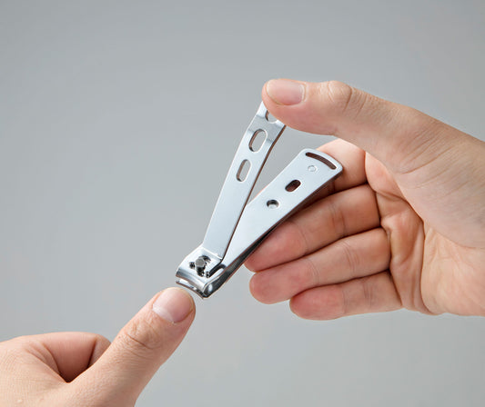 Seki Edge stainless nail clipper, sleek design held in hand for precise nail care
