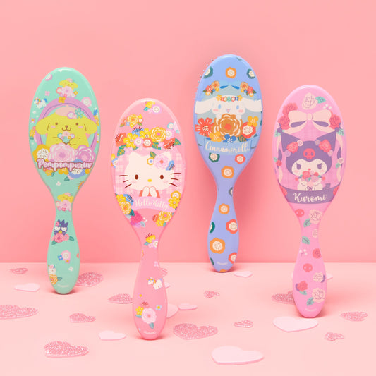 Collection of Wet Brush Hello Kitty detangler brush and cute character designs for effortless hair detangling