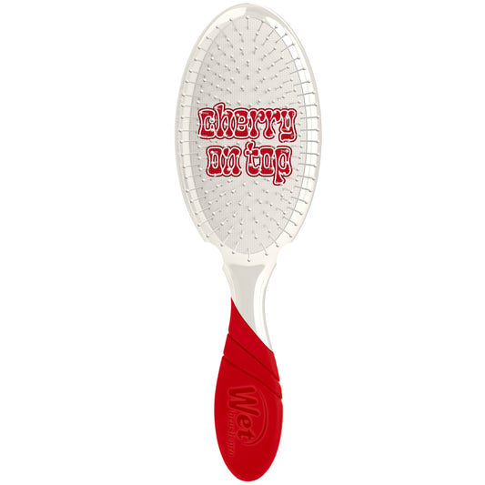 Wet Brush Pro Tutti Frutti Detangler with a vibrant red handle and flexible bristles for easy hair detangling