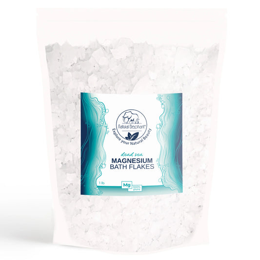 A white, resealable bag of Natural Elephant Dead Sea Magnesium Flakes features a blue and white label with the brand name and details. This 1 lb pack of magnesium flakes promotes muscle relaxation for a soothing bath soak.