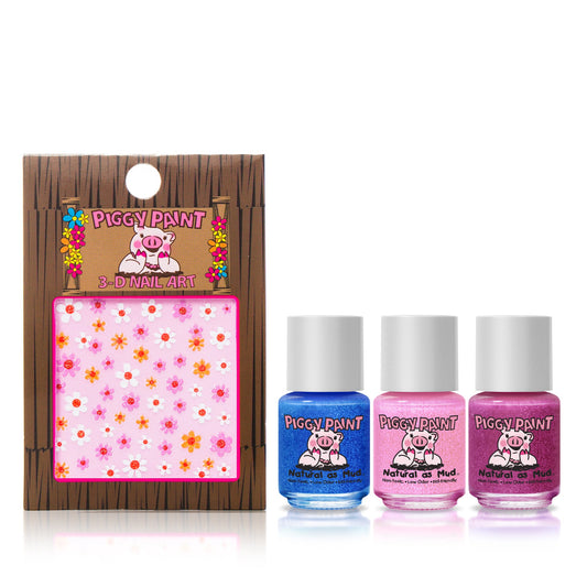 The Piggy Paint Shimmer & Sparkle Gift Set features three kid-friendly, non-toxic nail polishes in blue, light pink, and bright pink, displayed alongside a pack of colorful 3-D flower nail art stickers.
