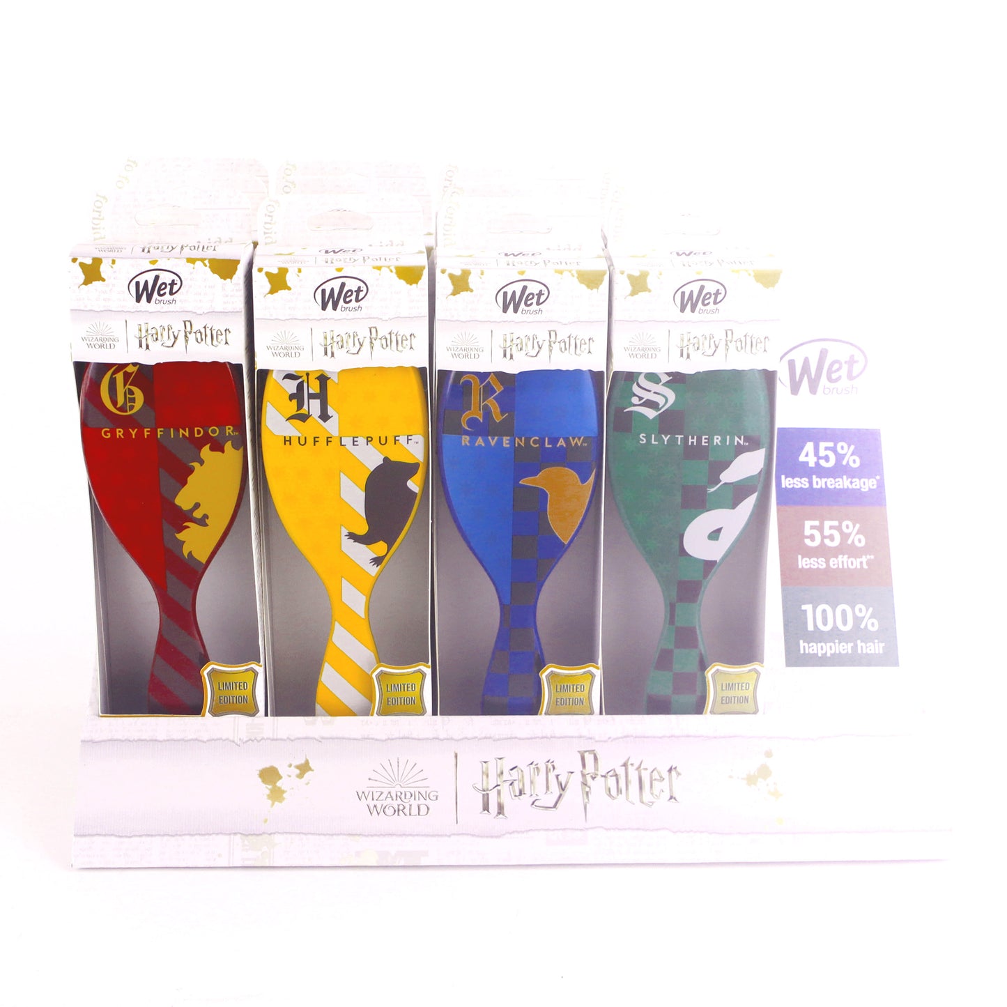 Four Wet Brush Original Detangler Harry Potter brushes in Gryffindor, Hufflepuff, Ravenclaw, and Slytherin designs are displayed on a white stand, offering less breakage, easier detangling, and happier hair for every hair type.