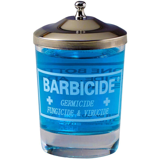 Barbicide jar for manicure table, blue liquid in a clear container with a metal lid for sanitizing tools