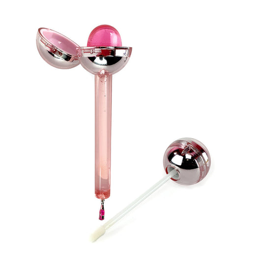 Glossy Pops Cheers lip gloss in a unique spherical container with a brush applicator