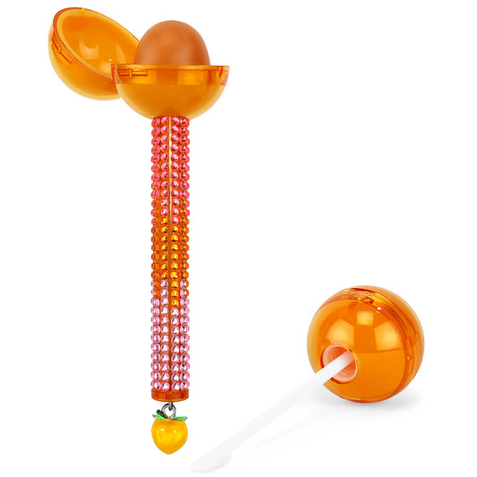 Glossy Pops TGI Fruity lip balm with vibrant orange container and cute charm for moisturizing lips