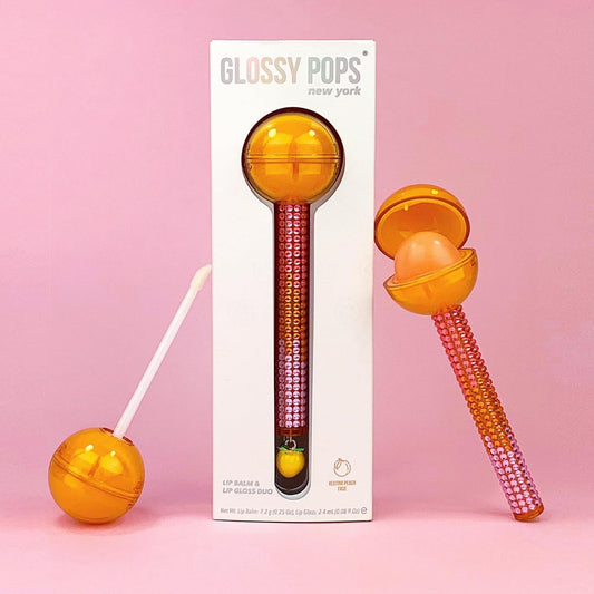 Glossy Pops TGI Fruity lip balm with colorful ball packaging and lip gloss duo in vibrant design