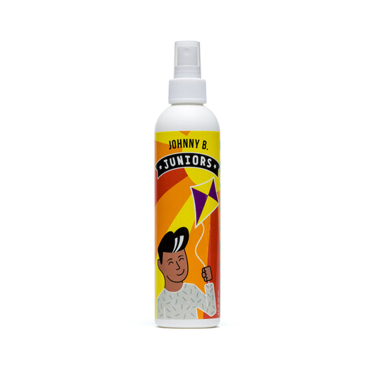 Johnny B Juniors Detangler spray in a spray bottle with colorful packaging for easy hair management