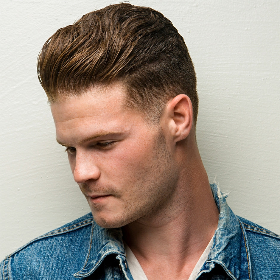 Man with stylish hairstyle using Johnny B Molding Paste for a polished look
