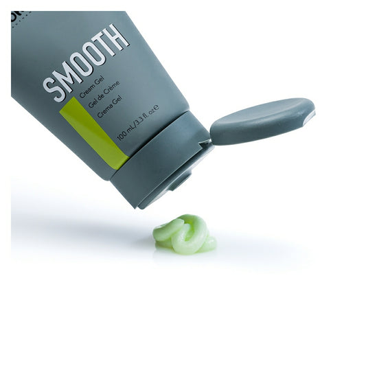 Johnny B Smooth Cream in a gray tube with a green cap and a small amount of cream gel on a white surface