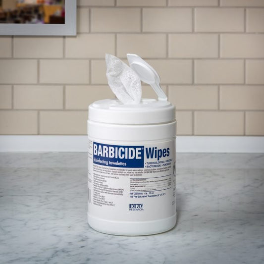 Barbicide disinfecting wipes in a tub for easy cleaning and sanitizing surfaces in professional settings
