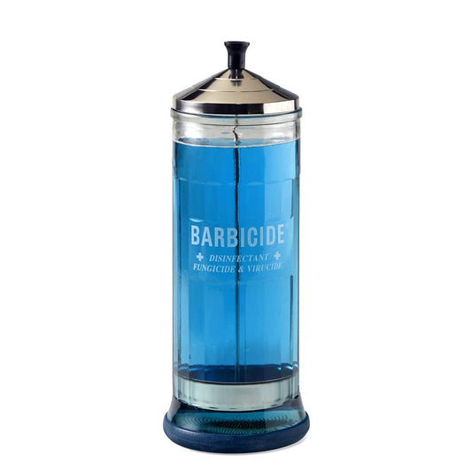 Large Barbicide jar with a silver lid, designed for disinfecting tools and equipment