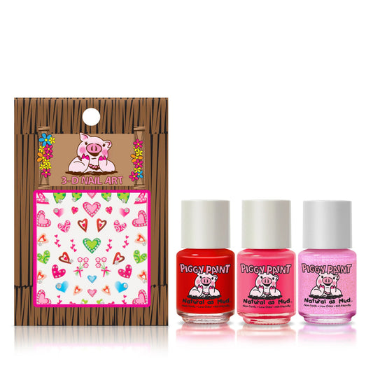 Piggy Paint gift set featuring red and pink nail polishes with 3D nail art supplies for creative fun