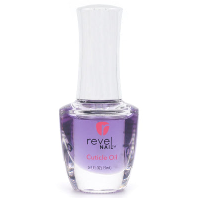A clear glass bottle of Revel Cuticle Oil Wildflower (15 mL) with a white cap. The label displays the brand name and moisturizing description in black and pink text. Ideal for keeping nails healthy and hydrated.