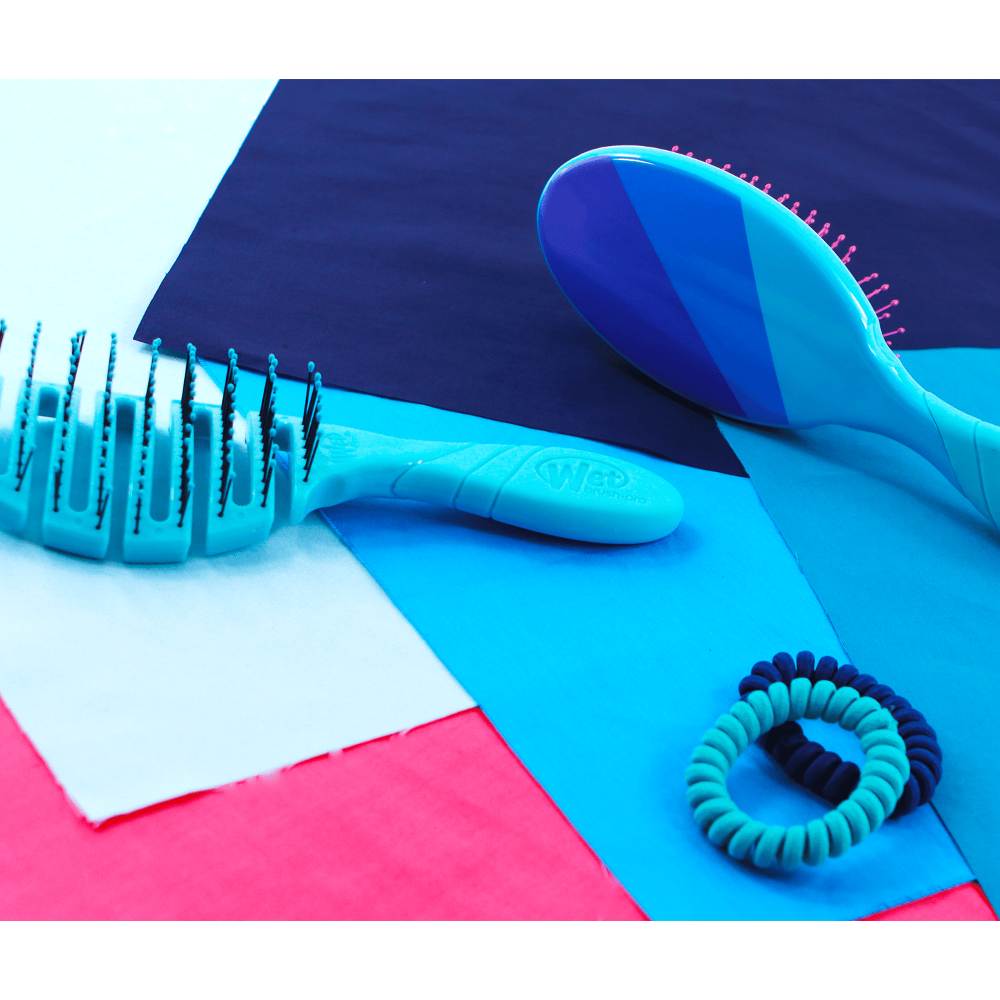 Wet Brush Color Me Happy Kit featuring a detangling brush and hair ties in vibrant colors