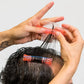 Hands using Seki Edge end papers for precise hair cutting and styling techniques