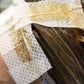 Seki Edge end papers for hair coloring treatment, shown applied to hair for effective dye absorption