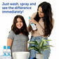 Mother spraying Fairy Tales kids detangling shampoo on smiling daughter with bottles and plant nearby