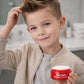 Boy styling hair with Fairy Tales Rosemary kids pomade for a fun and trendy look