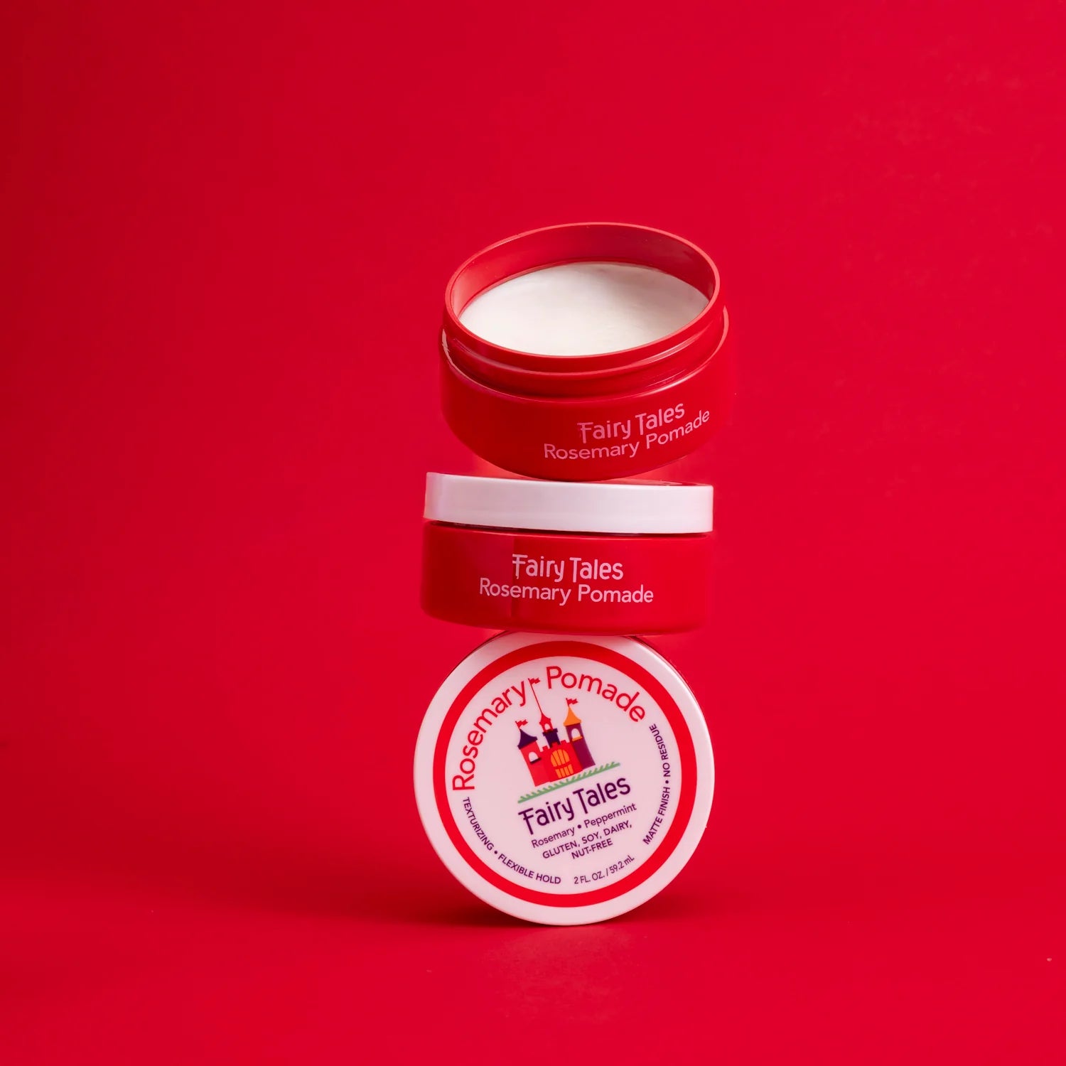 Fairy Tales Rosemary kids pomade stacked in red containers for easy styling and hold
