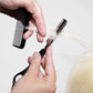 Feather razor blade being used to texture hair with a comb for a professional hairstyle