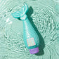 Glimmer Wish Mermaid Shampoo shaped like a mermaid tail, designed for nourishing hair in a vibrant ocean setting