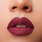 Close-up of lips wearing Glossy Pop Urban Lips Lipstick in a rich plum shade