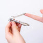 Seki Edge nail clipper for dogs held in hand, designed for precise grooming with ergonomic grip