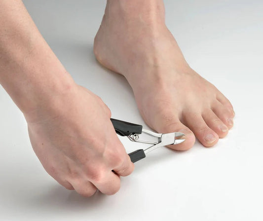 Seki Edge nail nipper in use for precise toenail care and grooming