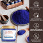 Natural Elephant indigo powder for hair in a jar with blue powder and wooden spoons on a table