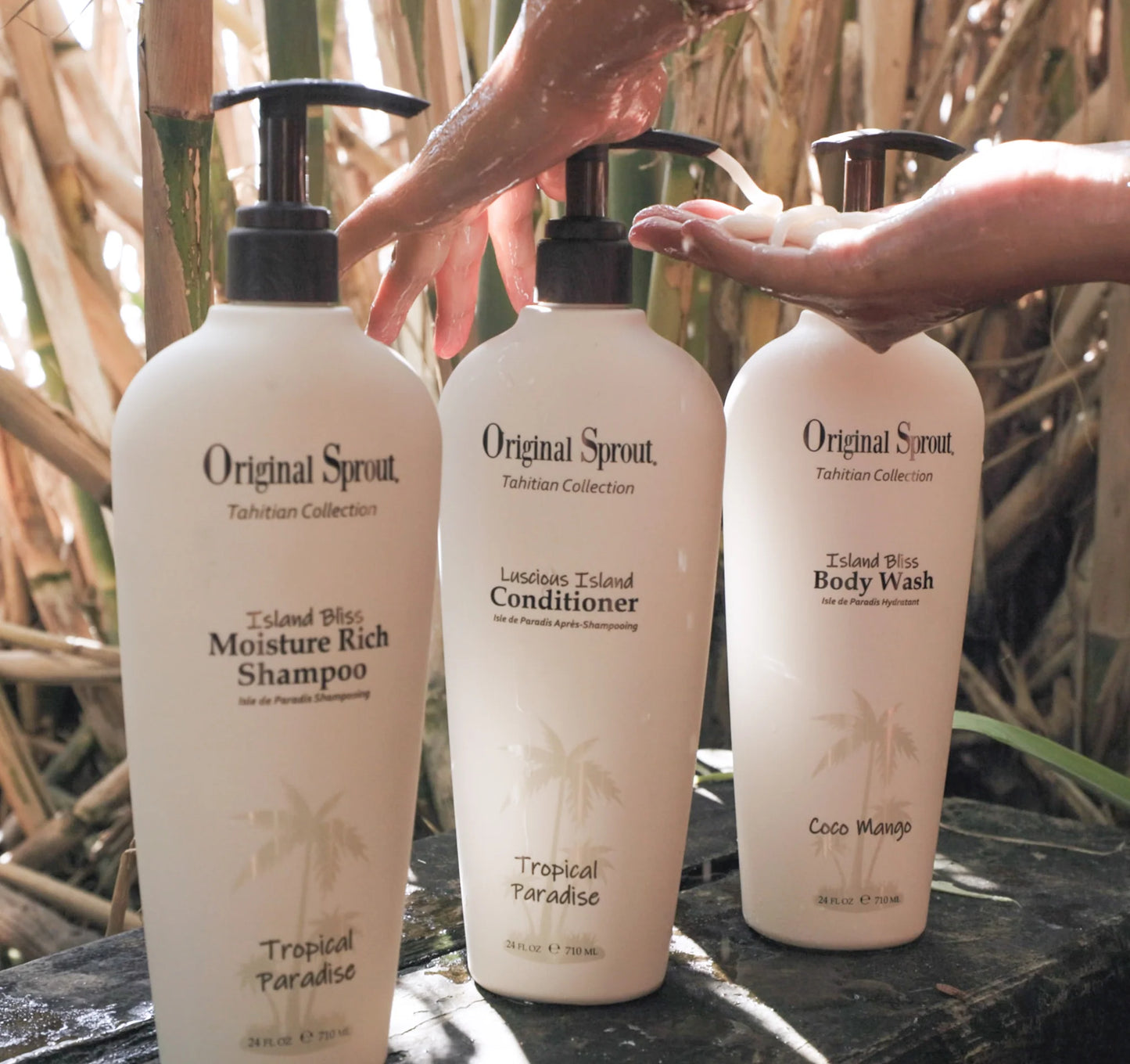 Original Sprout Luscious Island Conditioner bottle among other hair care products in a tropical setting