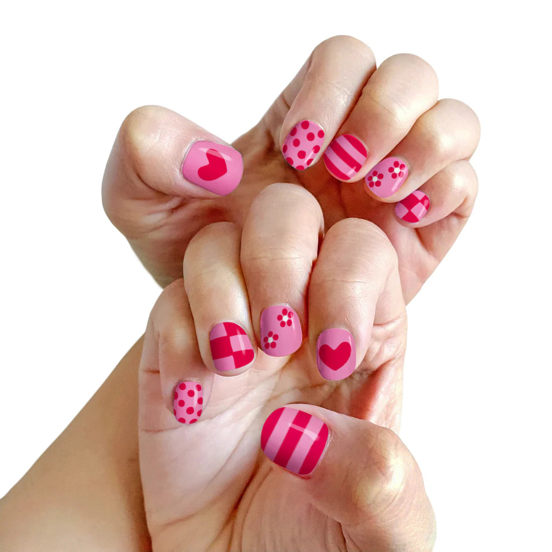 Colorful manicure with pink designs using Piggy Paint pen polishes for fun nail art