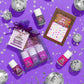 Piggy Paint Sparkle nail polish set with three vibrant colors and 3D nail art stickers on a colorful background