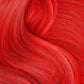Vibrant red hair dyed with Punky Colour temporary hair color spray for a bold look