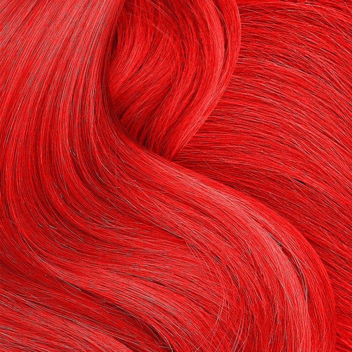 Vibrant red hair dyed with Punky Colour temporary hair color spray for a bold look