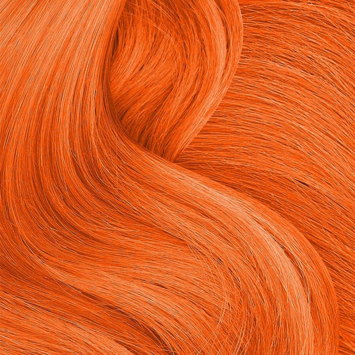 Vibrant orange hair styled with Punky Colour temporary hair color spray for a bold look