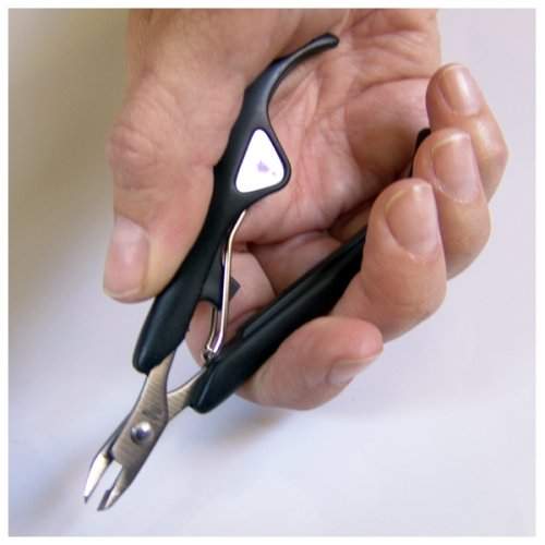 Seki Edge cuticle nipper held in hand for precise nail care and grooming