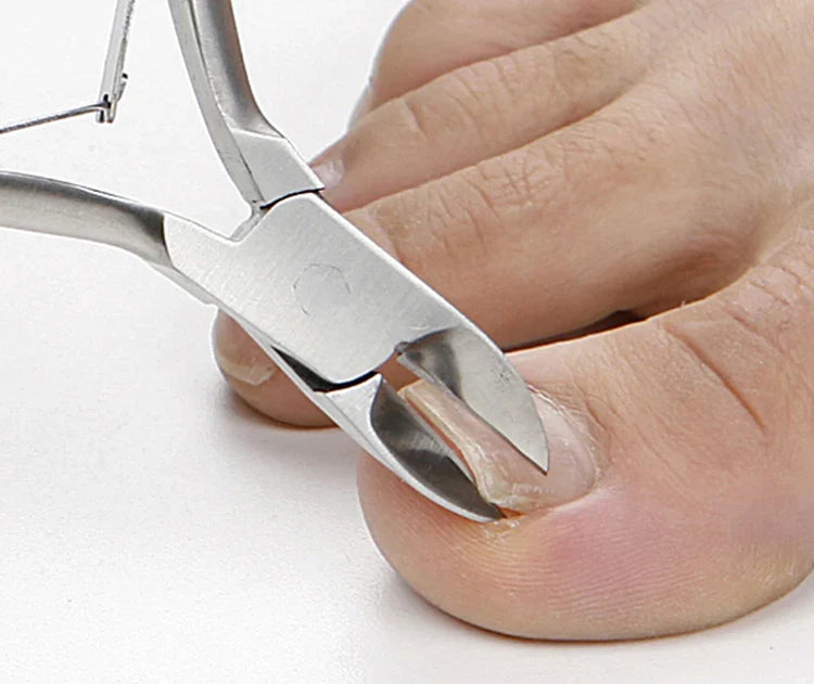 Close-up of Seki Edge nail clippers trimming a toenail for precise grooming