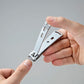 Seki Edge stainless nail clipper, sleek design held in hand for precise nail care
