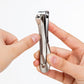 Seki Edge stainless steel nail clipper held between fingers for precise nail care