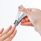 Seki Edge stainless steel nail clipper in use for precise nail trimming and grooming