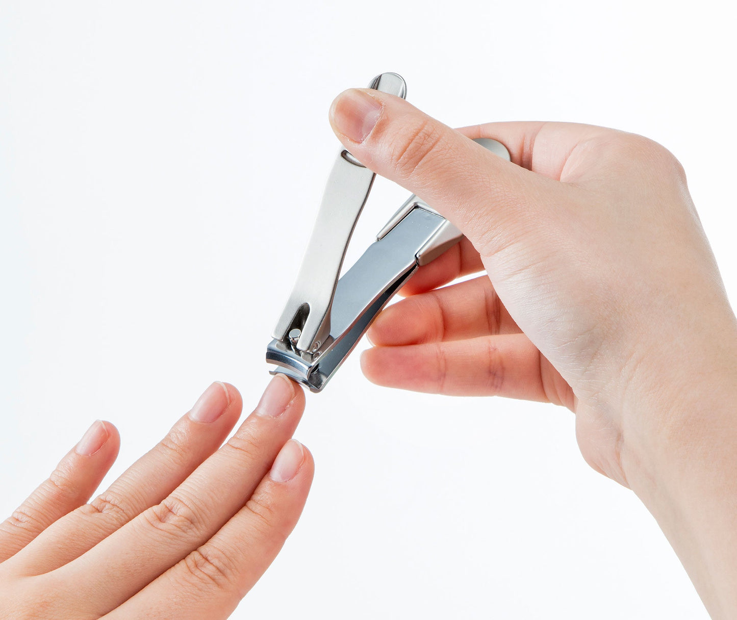 Seki Edge stainless steel nail clipper in use for precise nail trimming and grooming