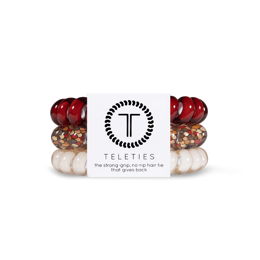 Teleties strong grip hair ties in red, white, and gold with no-rip design for reliable hold