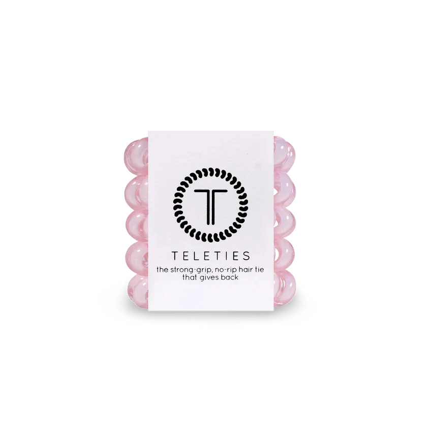Pack of Teleties tiny hair ties in pink, designed for a strong grip and no rip quality